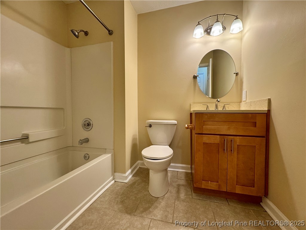 127 Nantahala Drive Linden, NC 28356 - Photo 18 of 22 a bathroom with a toilet sink and mirror
