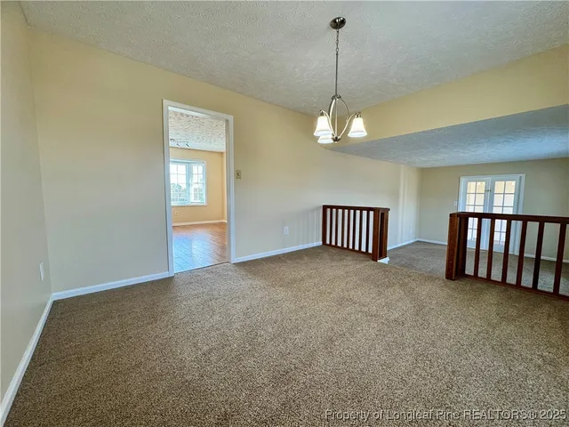a view of a livingroom with a staircase