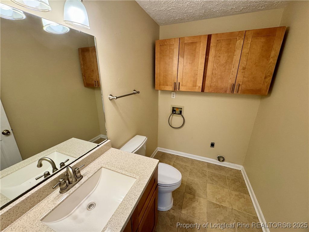 127 Nantahala Drive Linden, NC 28356 - Photo 9 of 22 a bathroom with a sink a toilet and shower