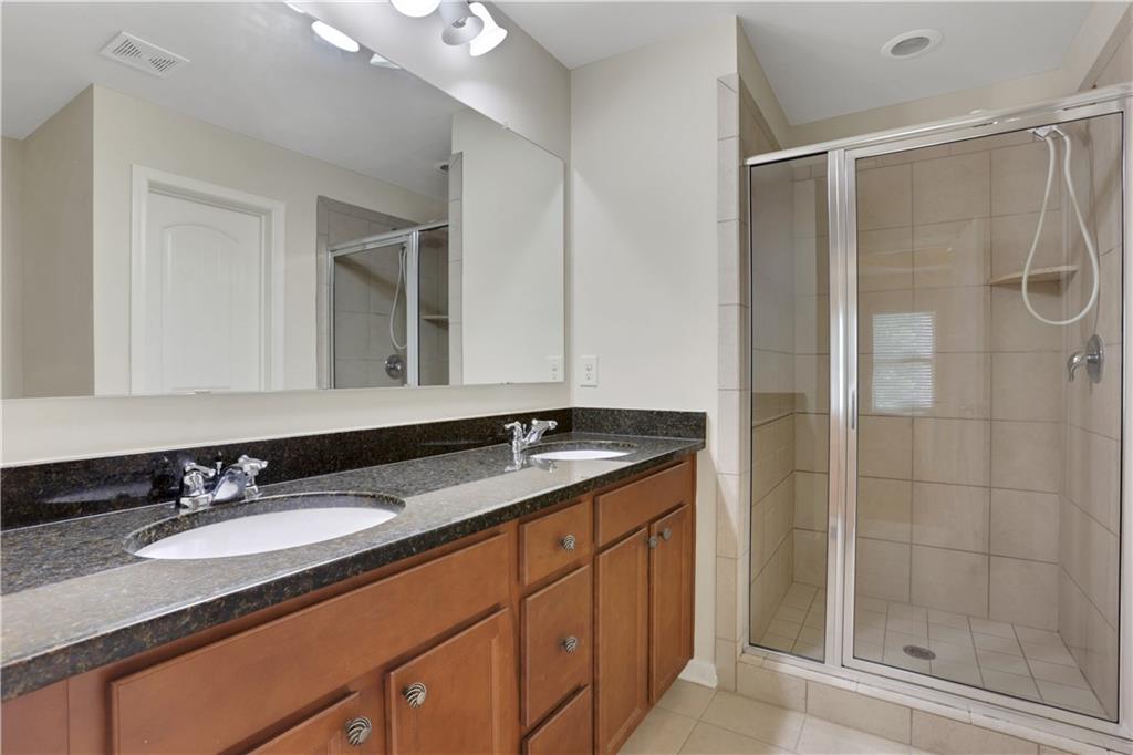 1300 Hopkins Drive Decatur, GA 30033 - Photo 15 of 30 a bathroom with a granite countertop sink mirror and double
