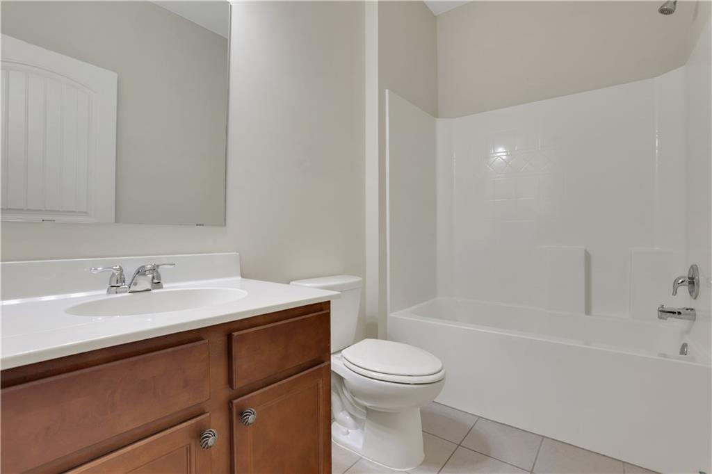 1300 Hopkins Drive Decatur, GA 30033 - Photo 26 of 30 a bathroom with a sink a toilet and shower