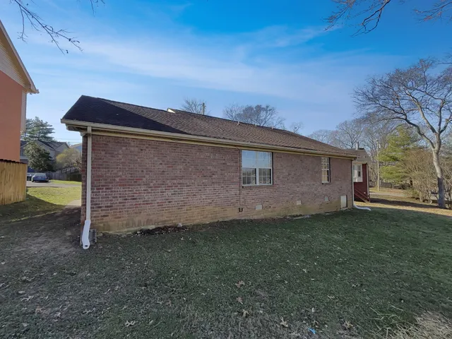 a backyard of a house with lots of green space