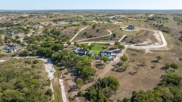 an aerial view of residential building and parking space
