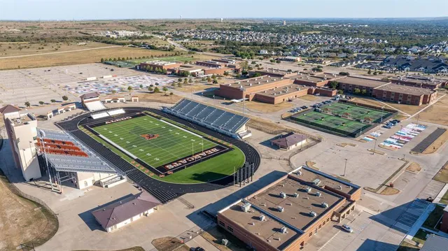 an aerial view of a residential apartment building with a lake view