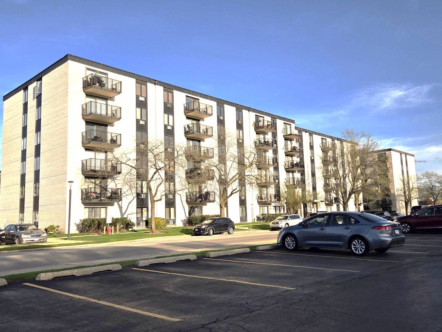 9701 North Dee Road, Unit 2G Niles, IL 60714 - Photo 1 of 18 a view of car parked in front of building