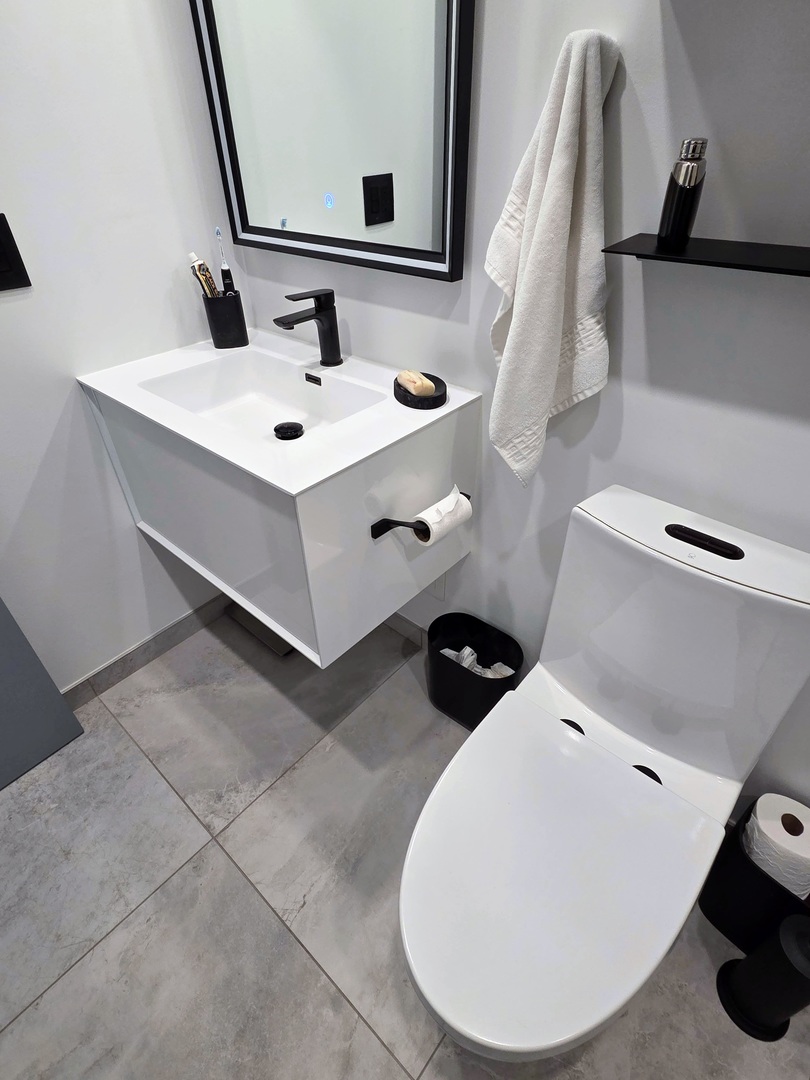 9701 North Dee Road, Unit 2G Niles, IL 60714 - Photo 11 of 18 a bathroom with a sink and mirror