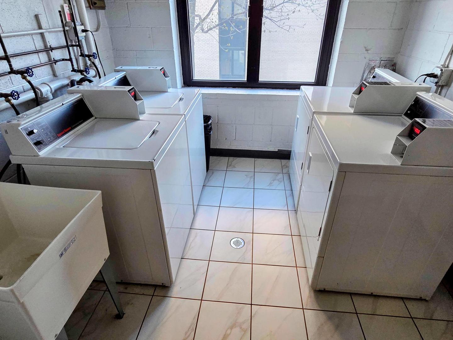 9701 North Dee Road, Unit 2G Niles, IL 60714 - Photo 18 of 18 a utility room with dryer and washer