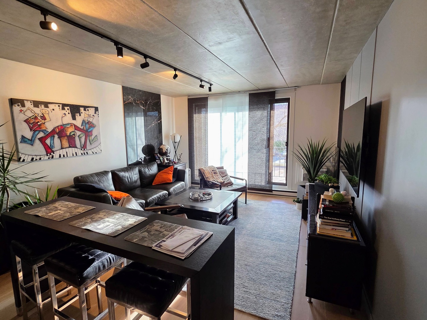 9701 North Dee Road, Unit 2G Niles, IL 60714 - Photo 2 of 18 a living room with furniture and a flat screen tv