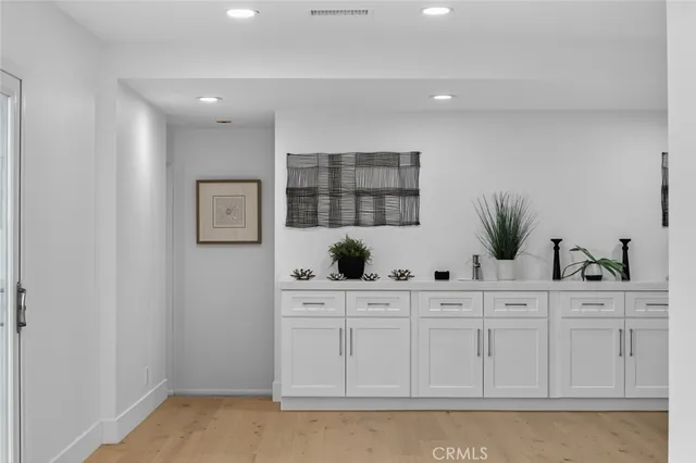 a bathroom with a sink and cabinets