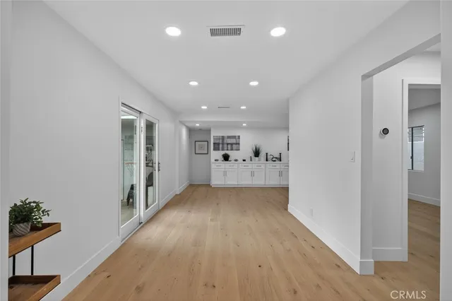 a view of entryway with wooden floor