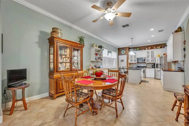 a dining room with furniture and window
