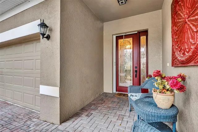 a living room with furniture and flowers