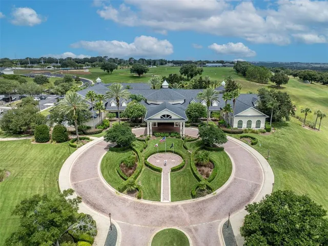 an aerial view of a house with garden space and lake view