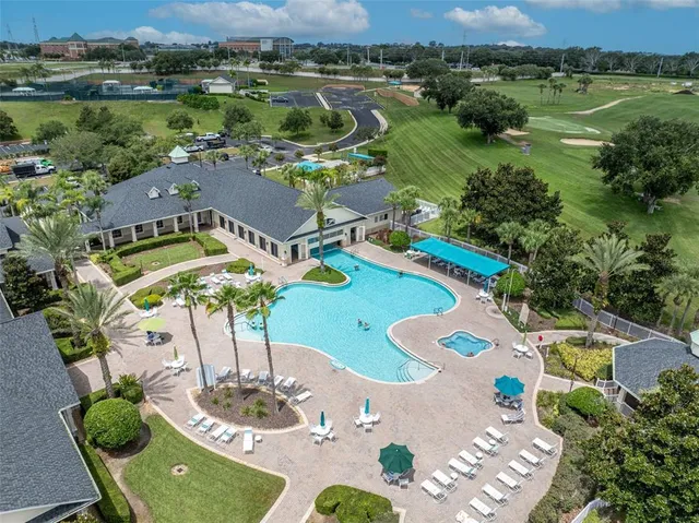 an aerial view of a residential houses with outdoor space