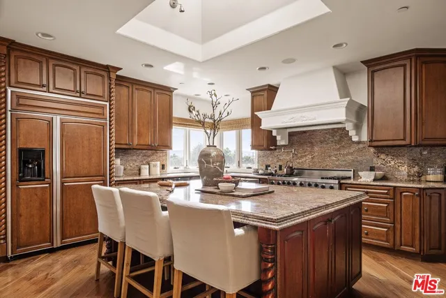 a bedroom with a large bed and a large window