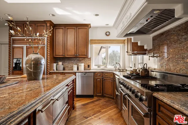 a bedroom with a bed and a fireplace