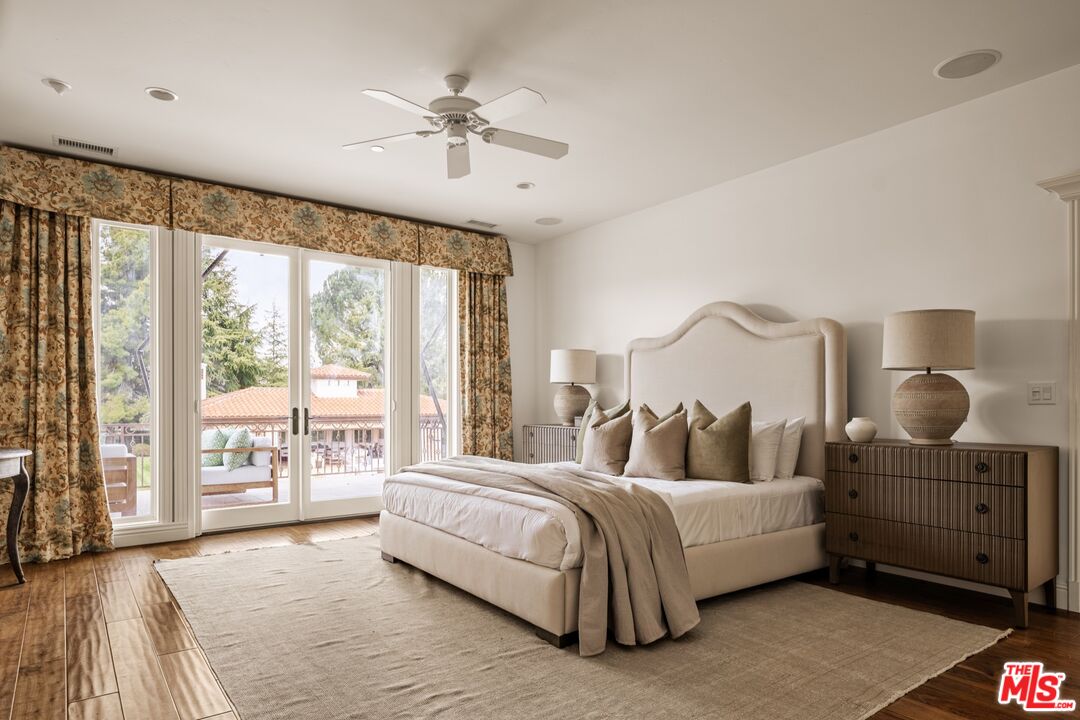 2370 North Refugio Road Santa Ynez, CA 93460 - Photo 15 of 66 a bedroom with a large bed and a large window