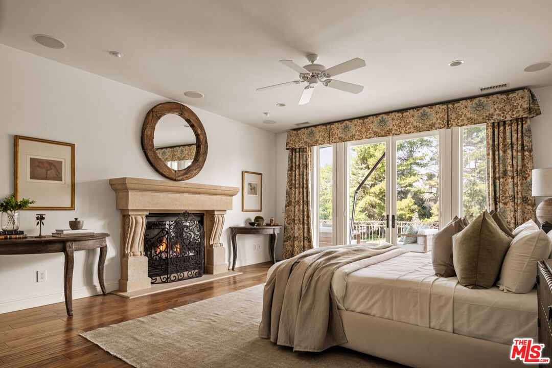 2370 North Refugio Road Santa Ynez, CA 93460 - Photo 16 of 66 a bedroom with a bed and a fireplace