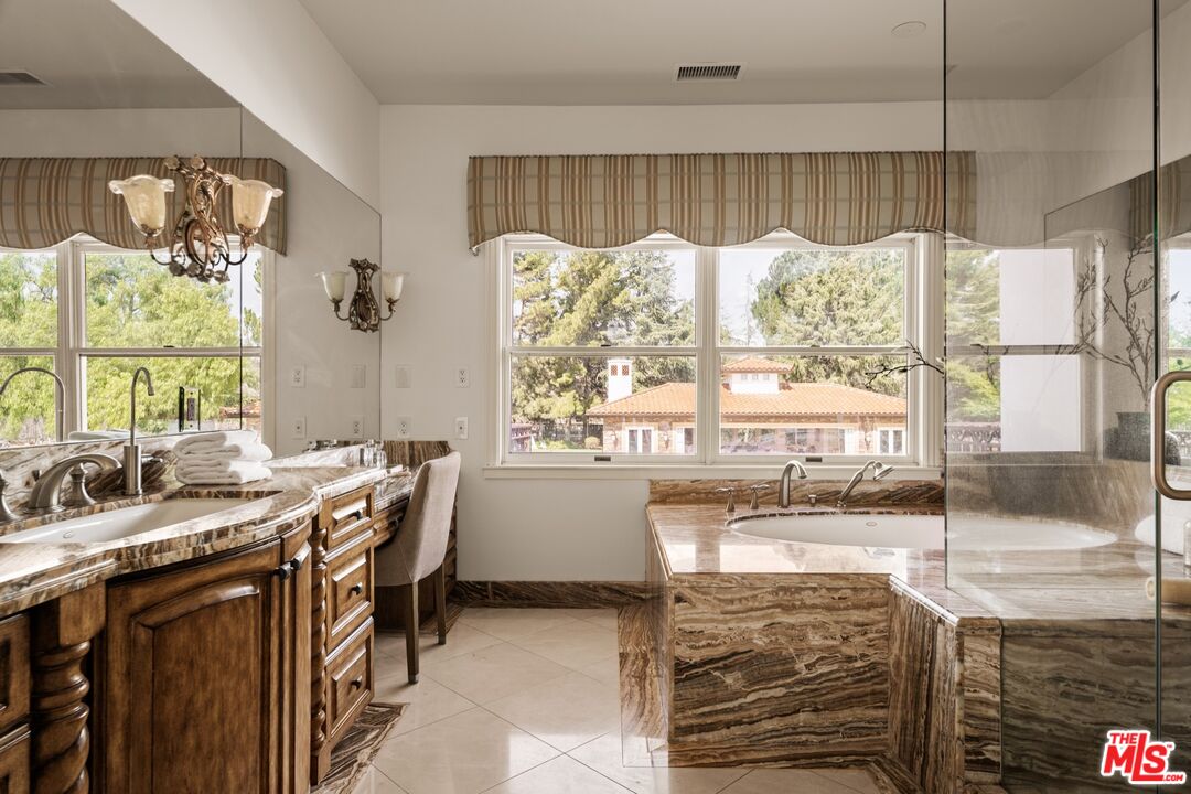 2370 North Refugio Road Santa Ynez, CA 93460 - Photo 18 of 66 a kitchen with a table chairs and a window