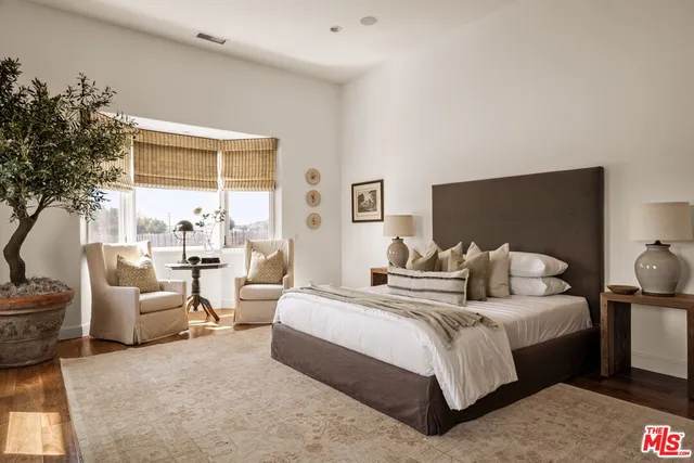 a view of a room with a table and a potted plant