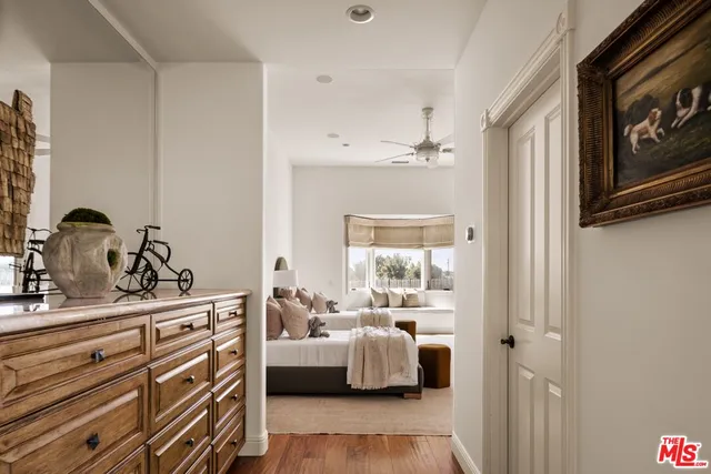 a view of the patio with couches and a table and chairs with garden view