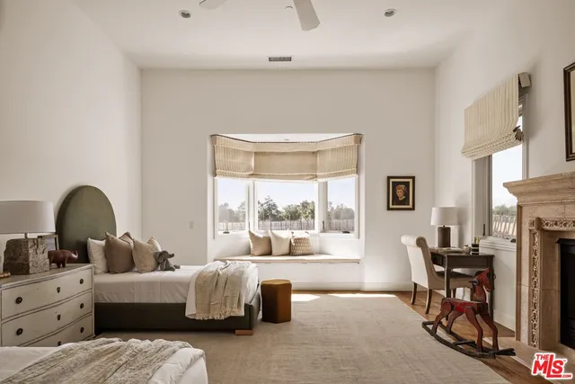 a view of a house with swimming pool and sitting area