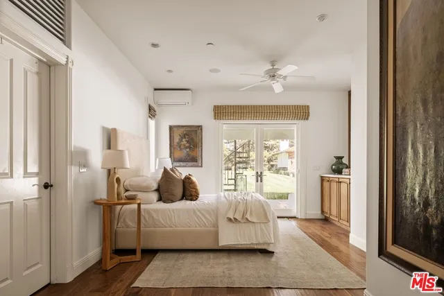 a view of a house with swimming pool and sitting area