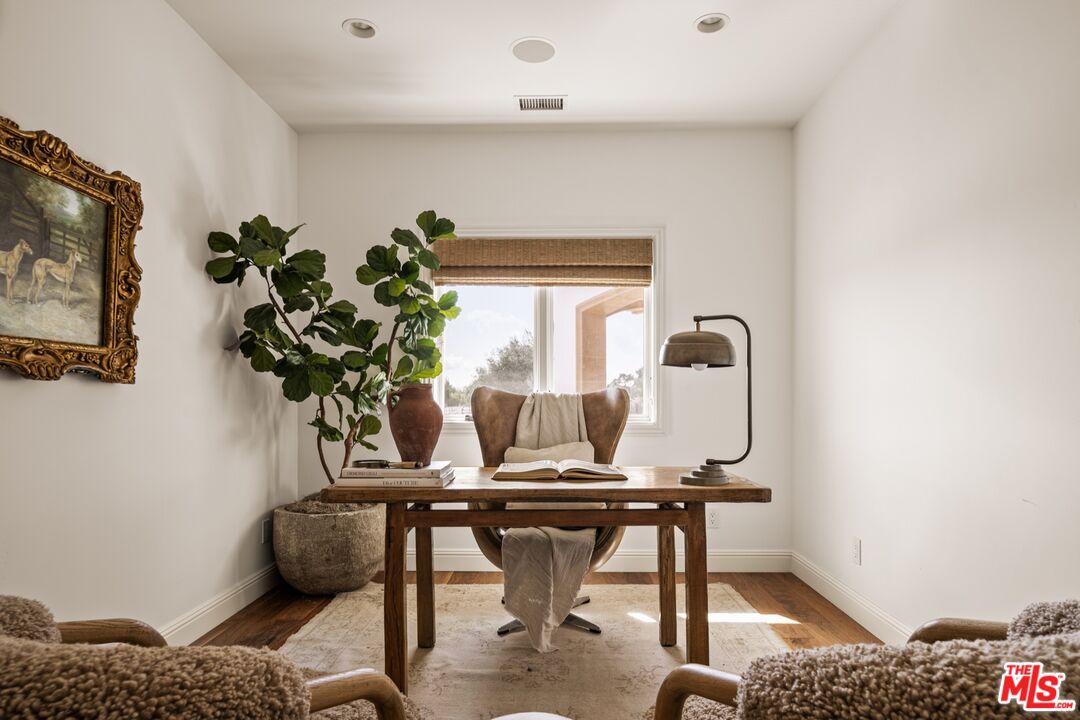 2370 North Refugio Road Santa Ynez, CA 93460 - Photo 27 of 66 a view of a room with a table and a potted plant