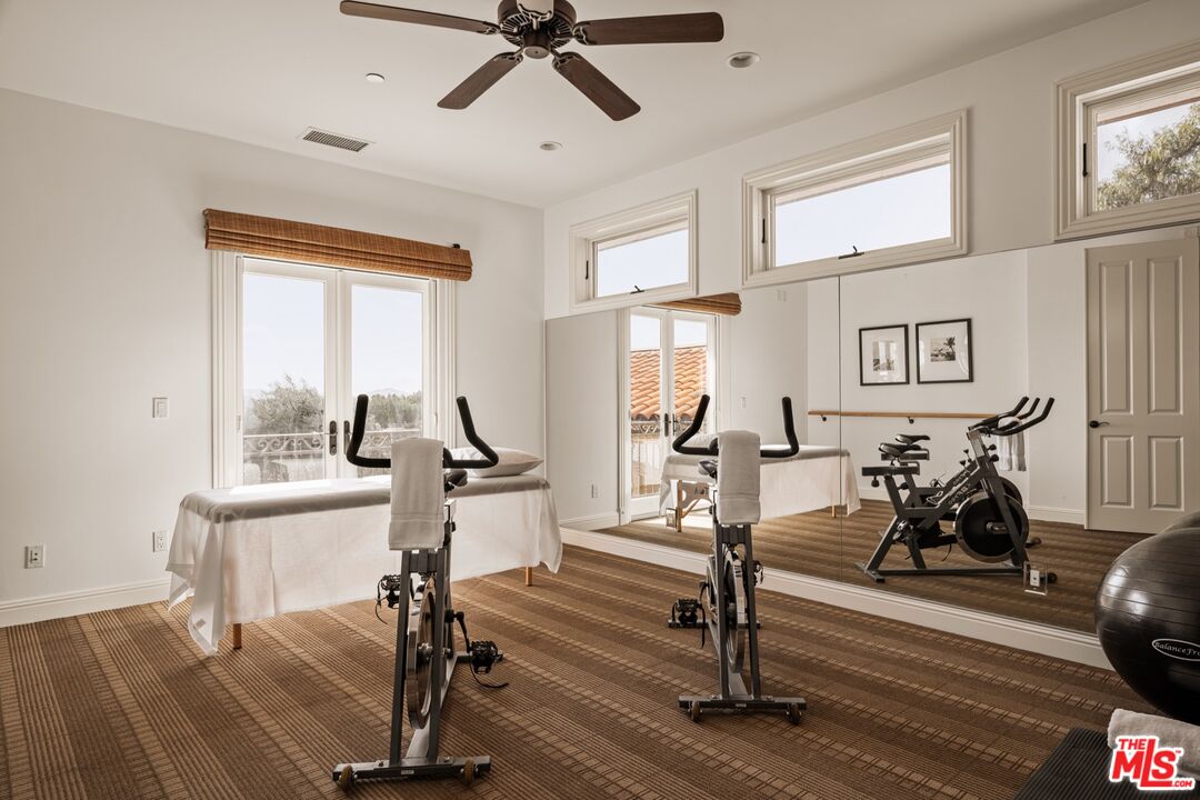 2370 North Refugio Road Santa Ynez, CA 93460 - Photo 28 of 66 a view of a livingroom with furniture gym cycle and a window