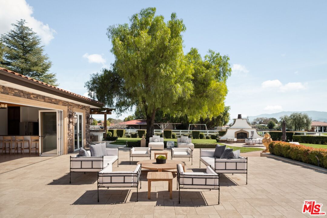 2370 North Refugio Road Santa Ynez, CA 93460 - Photo 29 of 66 a view of the patio with couches and a table and chairs with garden view