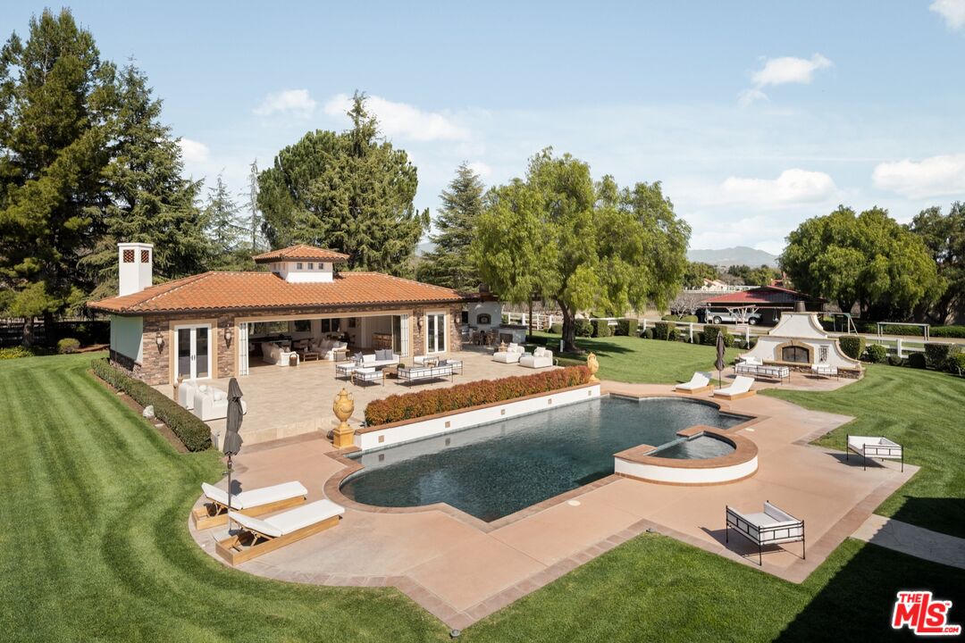 2370 North Refugio Road Santa Ynez, CA 93460 - Photo 30 of 66 a view of a house with swimming pool and sitting area