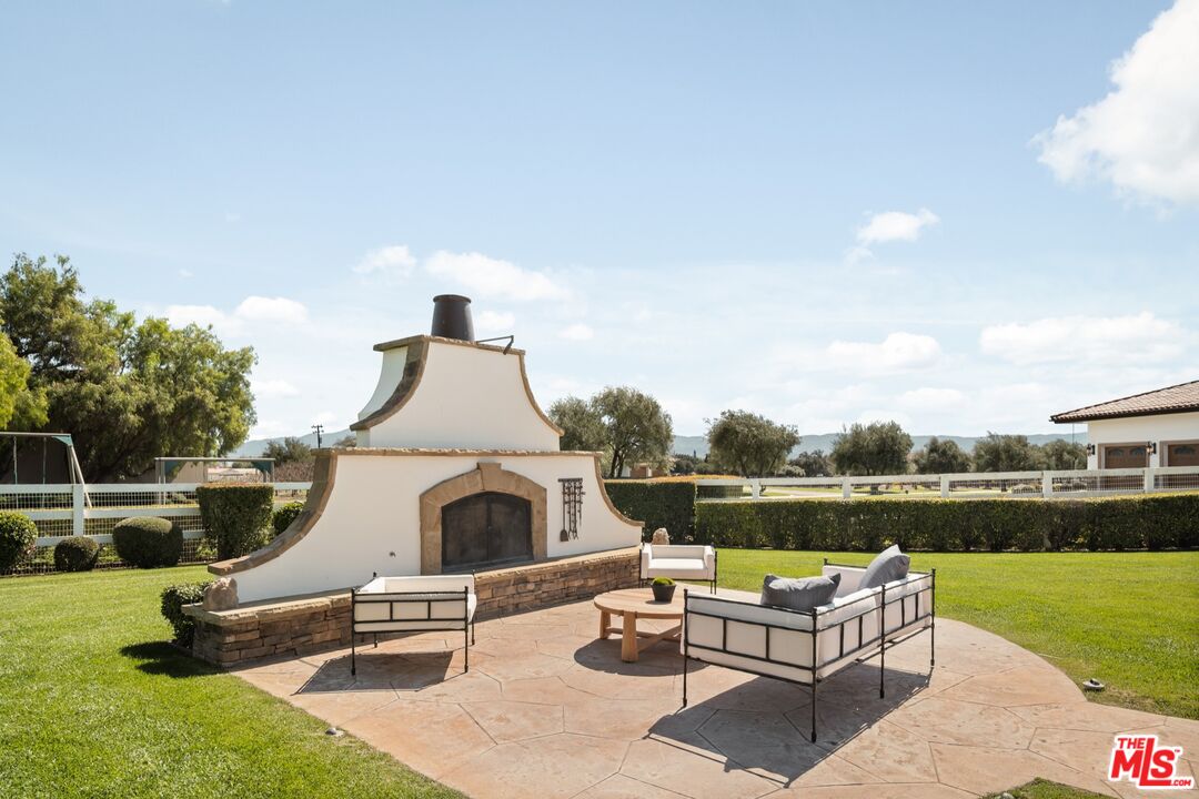 2370 North Refugio Road Santa Ynez, CA 93460 - Photo 33 of 66 an outdoor sitting area with couch and city view