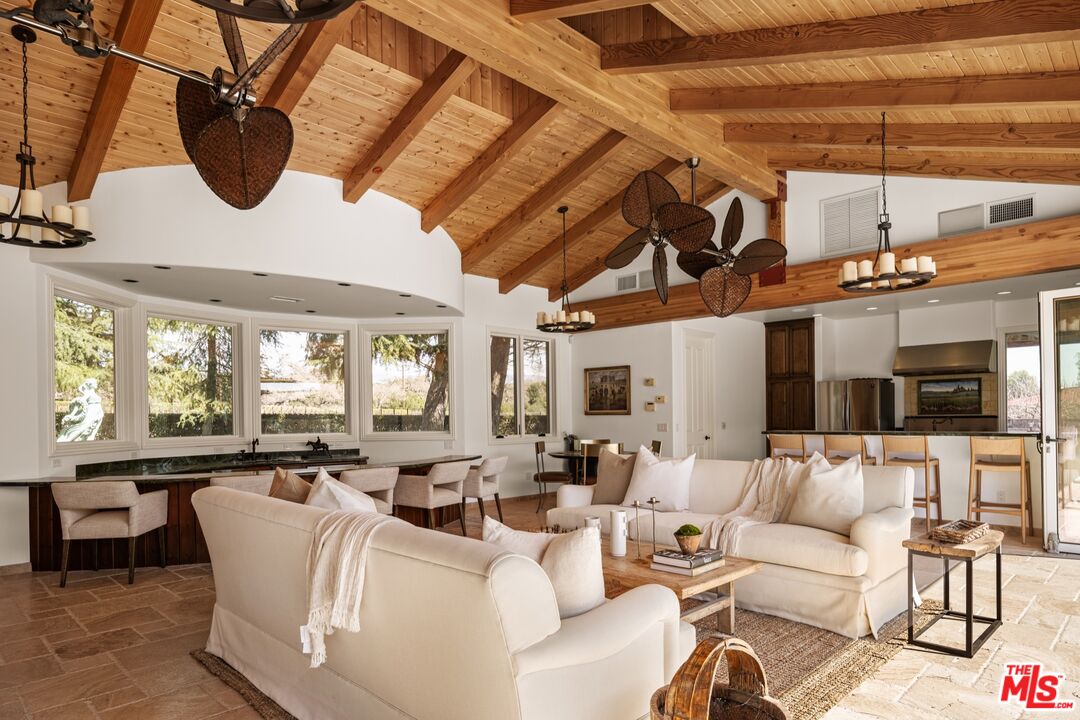 2370 North Refugio Road Santa Ynez, CA 93460 - Photo 35 of 66 a living room with furniture and a flat screen tv