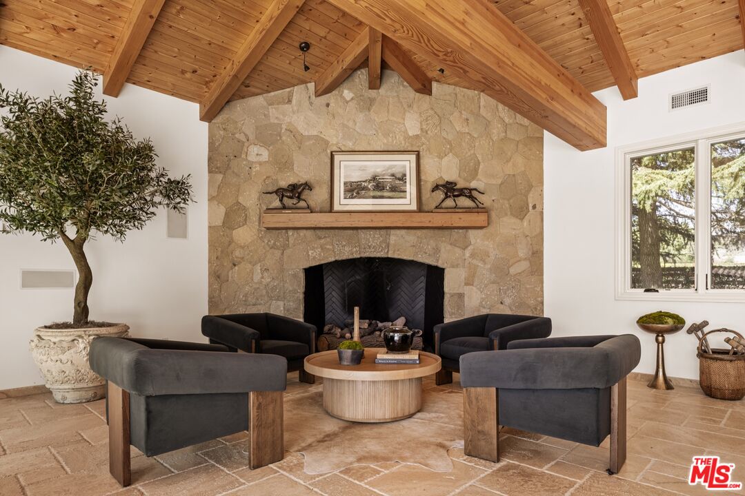 2370 North Refugio Road Santa Ynez, CA 93460 - Photo 36 of 66 a living room with furniture and a fireplace
