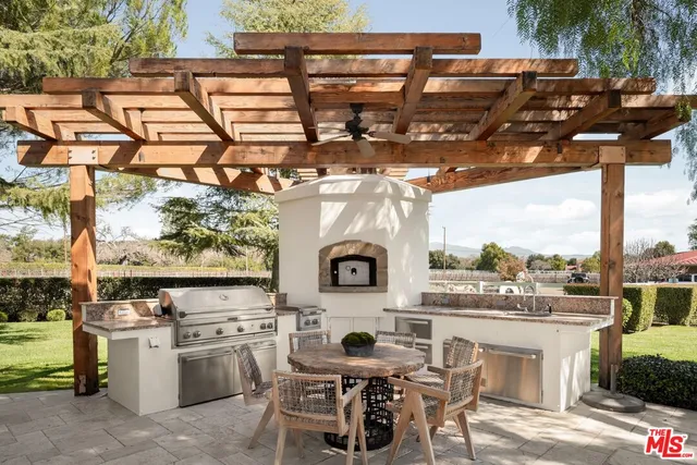 a bathroom with a toilet a sink and a mirror