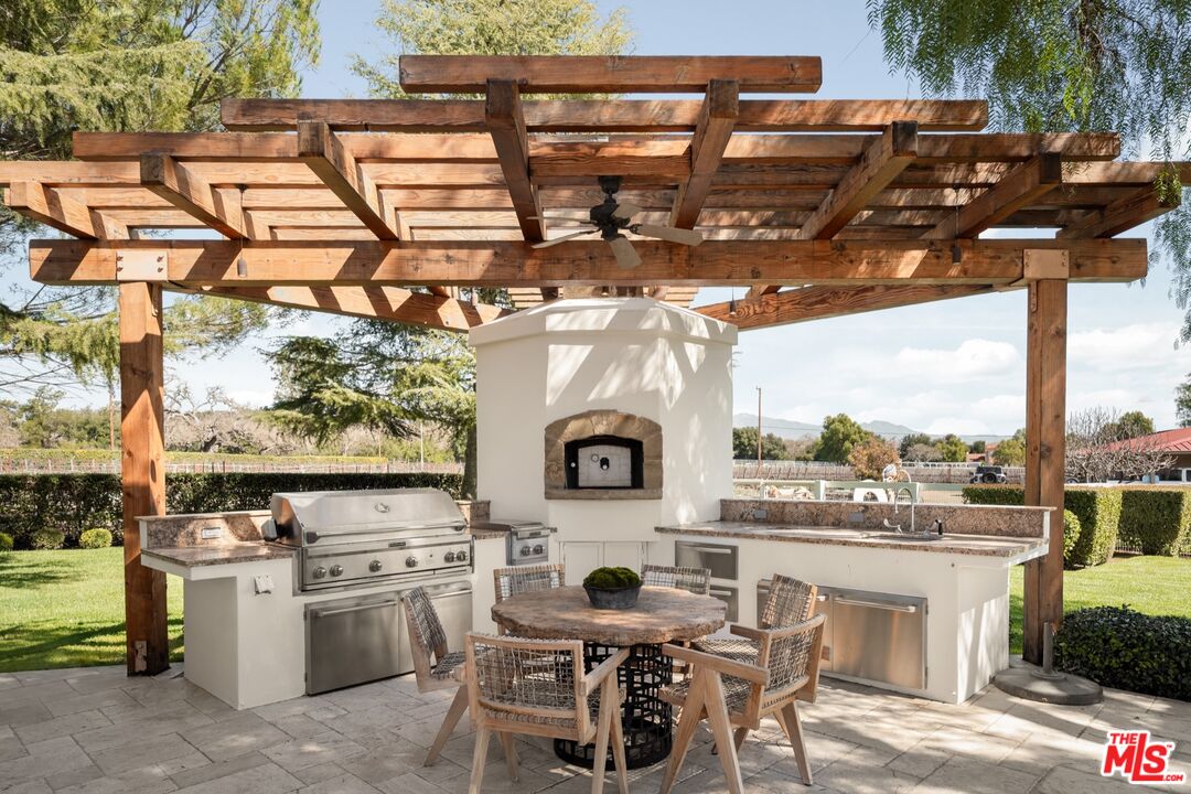 2370 North Refugio Road Santa Ynez, CA 93460 - Photo 40 of 66 a view of a chairs and table in the patio