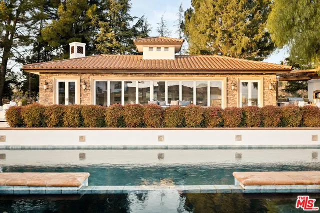 a bedroom with bed and a window