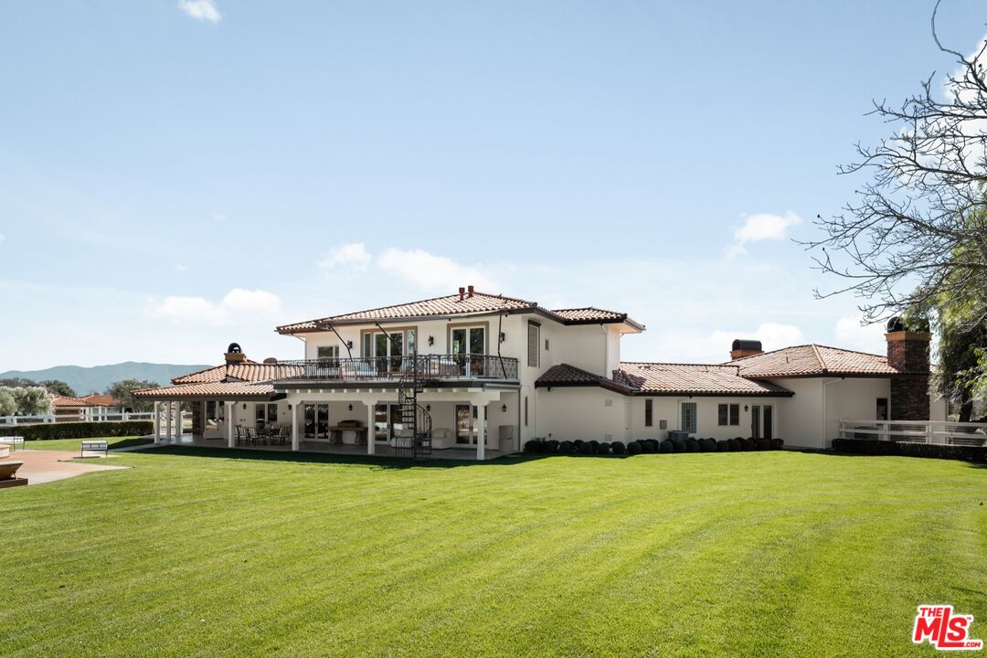 2370 North Refugio Road Santa Ynez, CA 93460 - Photo 42 of 66 a front view of a house with a garden and deck
