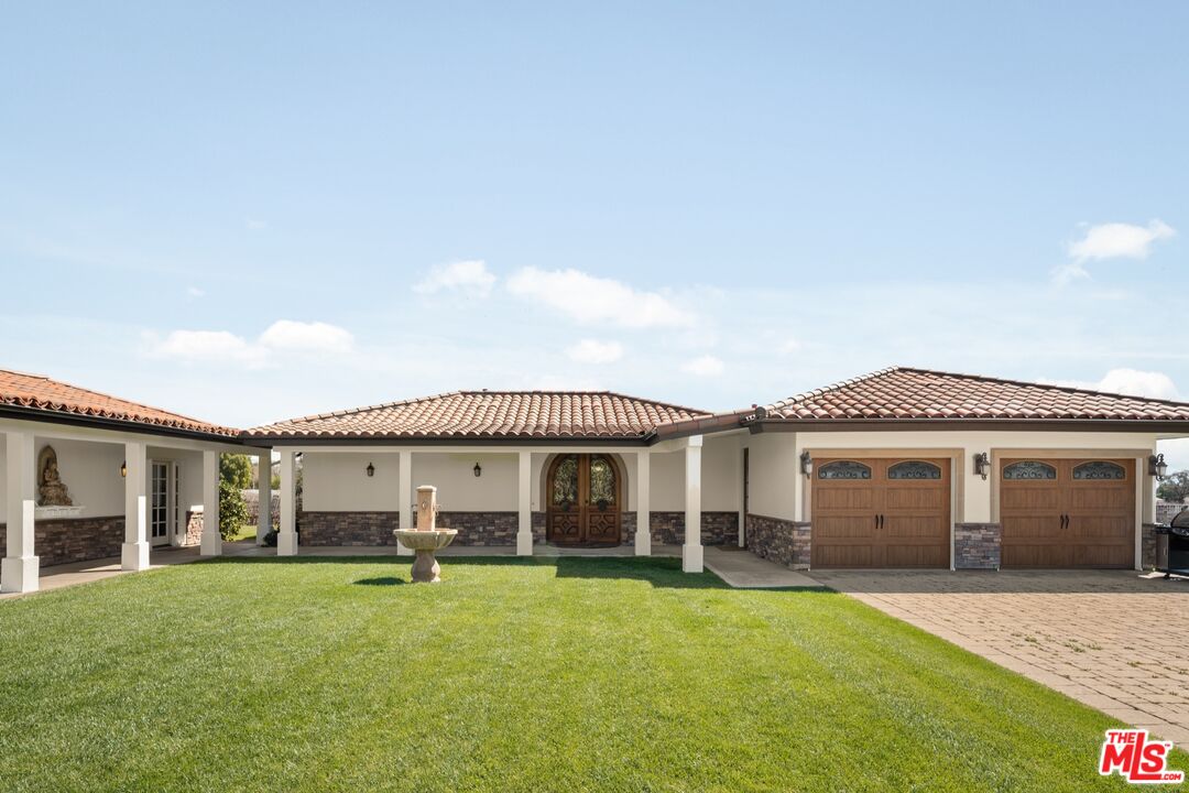 2370 North Refugio Road Santa Ynez, CA 93460 - Photo 43 of 66 a view of a house with a yard and porch