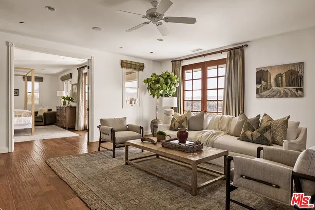 a view of a terrace with yard and mountain view in back