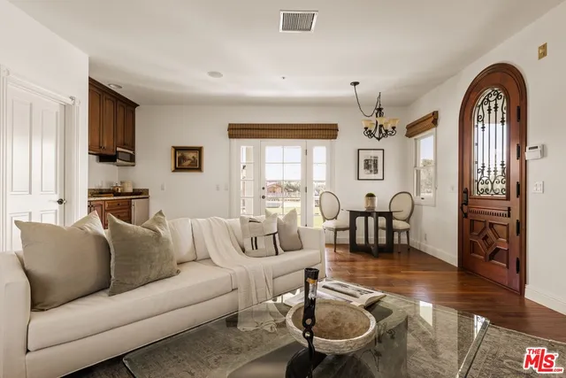 a room with furniture and a potted plant