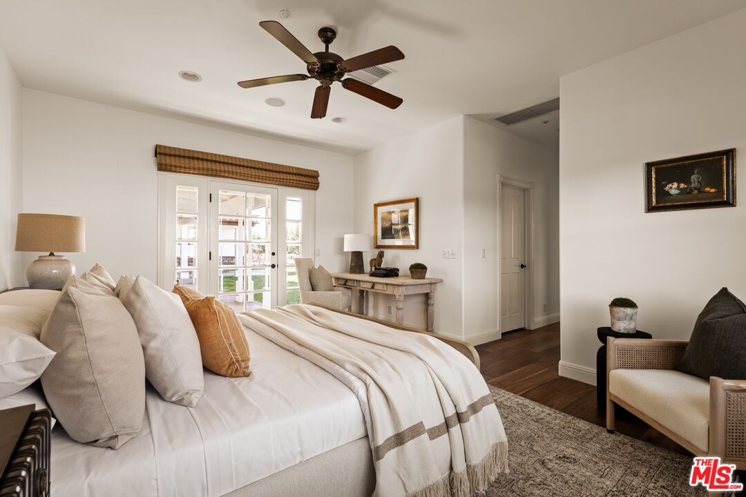 2370 North Refugio Road Santa Ynez, CA 93460 - Photo 47 of 66 a bedroom with a bed a couch and a window