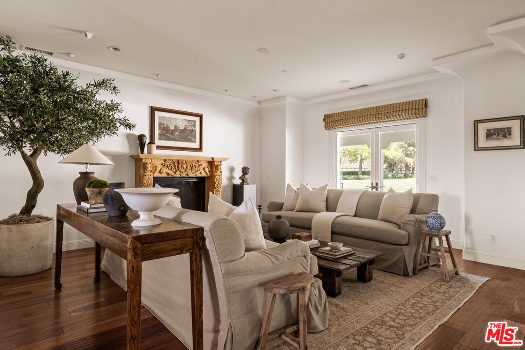 2370 North Refugio Road Santa Ynez, CA 93460 - Photo 8 of 66 a living room with furniture a fireplace and a large window