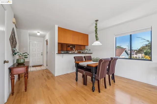 a kitchen with a sink cabinets stainless steel appliances and a window