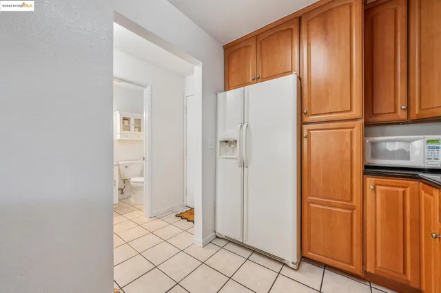 a kitchen with stainless steel appliances granite countertop wooden cabinets a sink and dishwasher