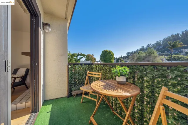 a view of a hallway with wooden floor and entryway