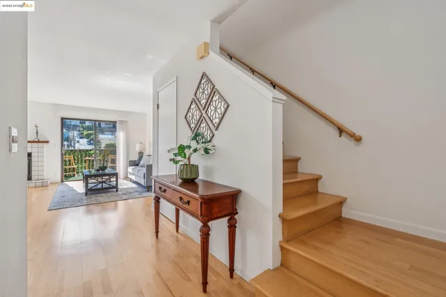 a living room with a bed furniture and a window