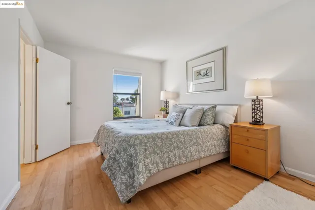 a bedroom with a bed and a view of bathroom