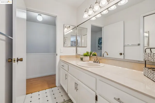 a bedroom with bed and a desk