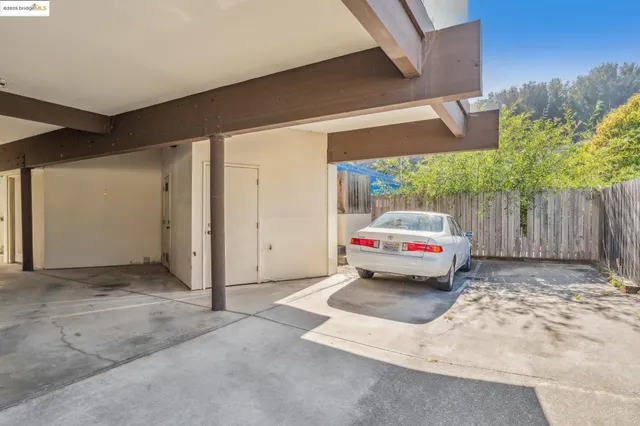 a view of a house with a chairs in patio